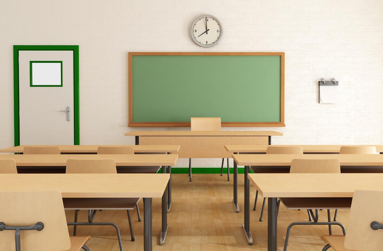 Classroom without students with wooden furniture and green blackboard on brick-wall-rendering