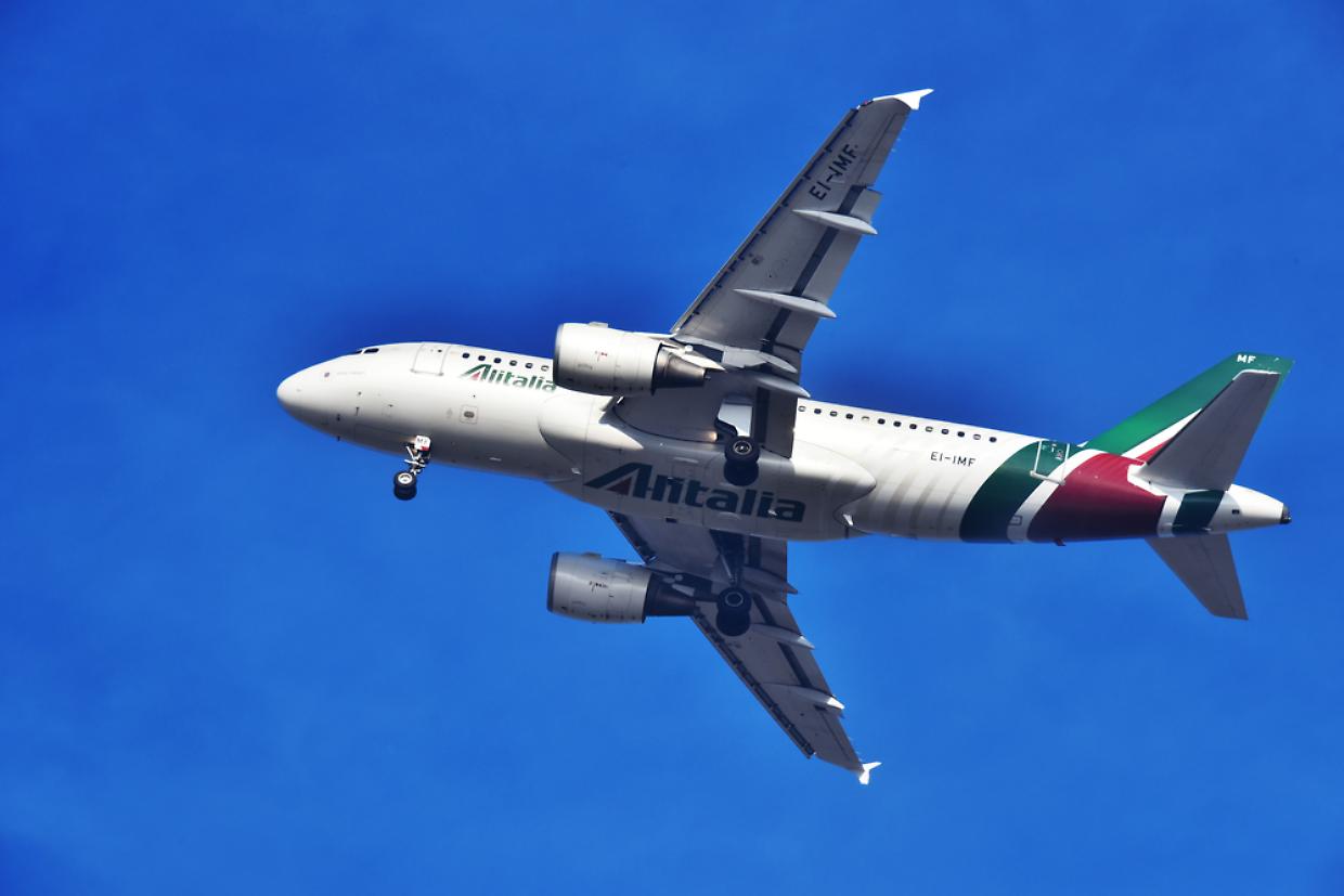 Airplane of Alitalia approaching the airport