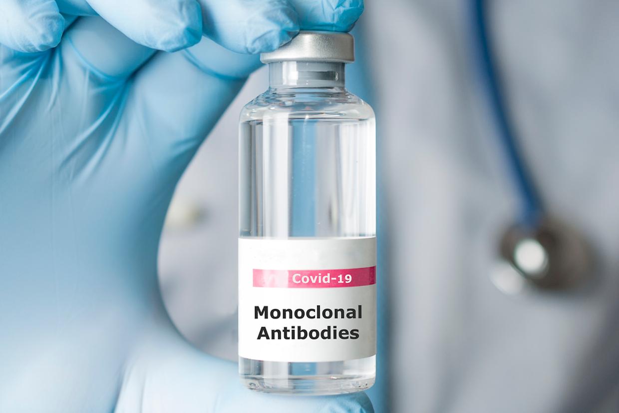 Doctor hold a vial of monoclonal antibodies, a new treatment for
