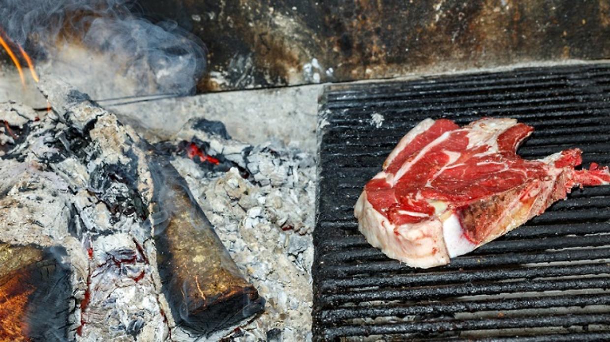 T-bone steak raw on the grill