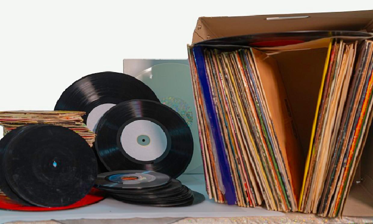 Pile of 45 and 33 RPM vinyl records used. And dirty even