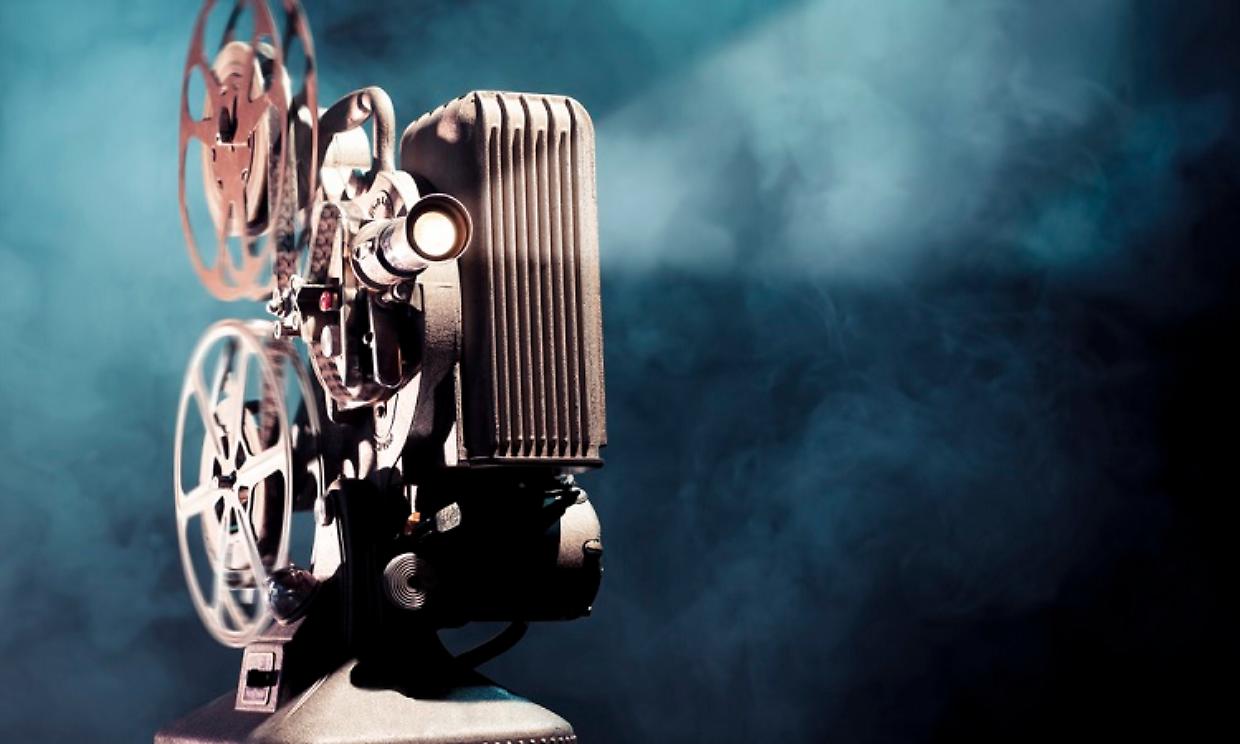old film projector with dramatic lighting