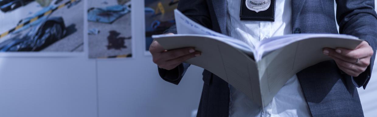 Policewoman holding book