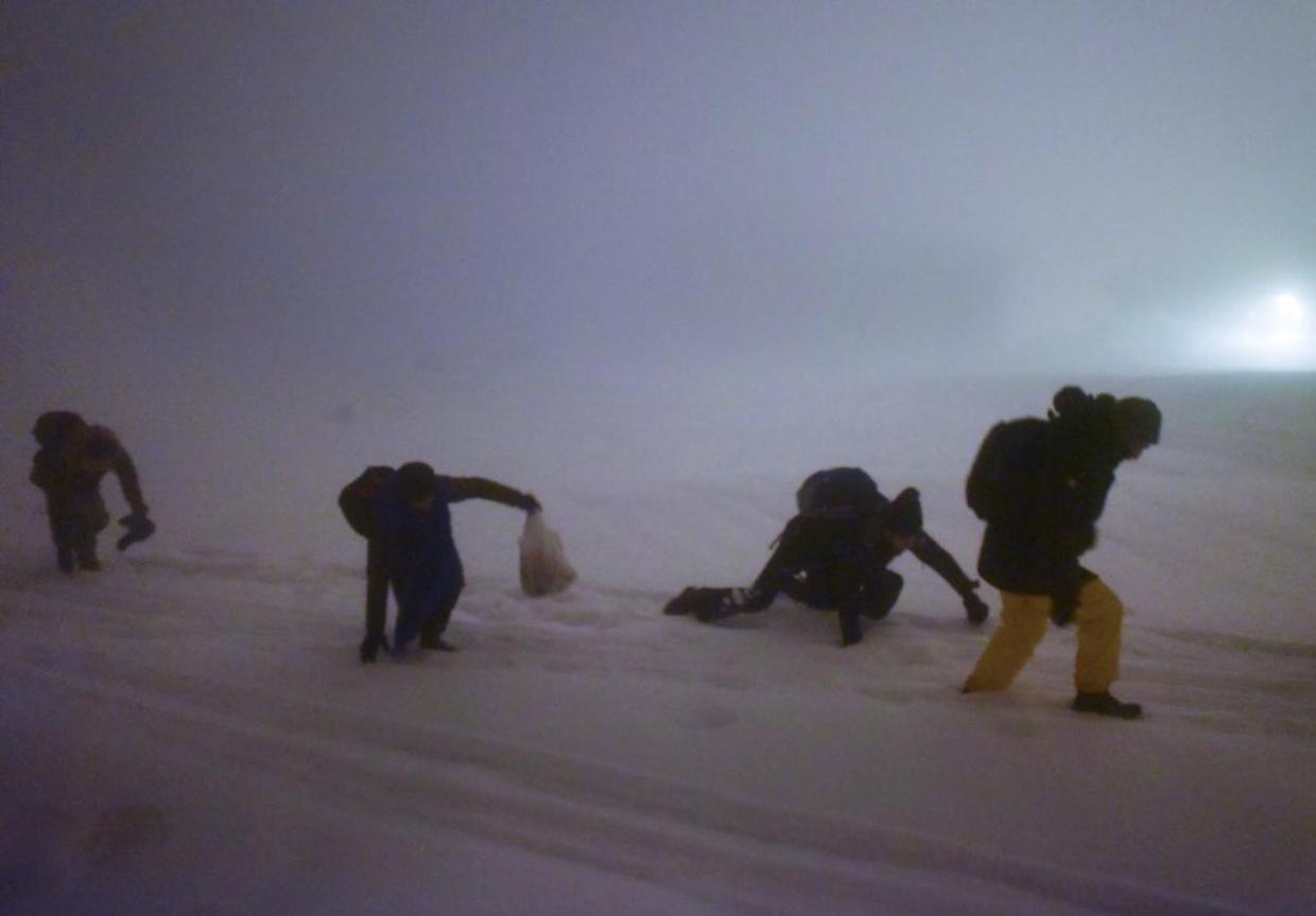 migranti nella neve