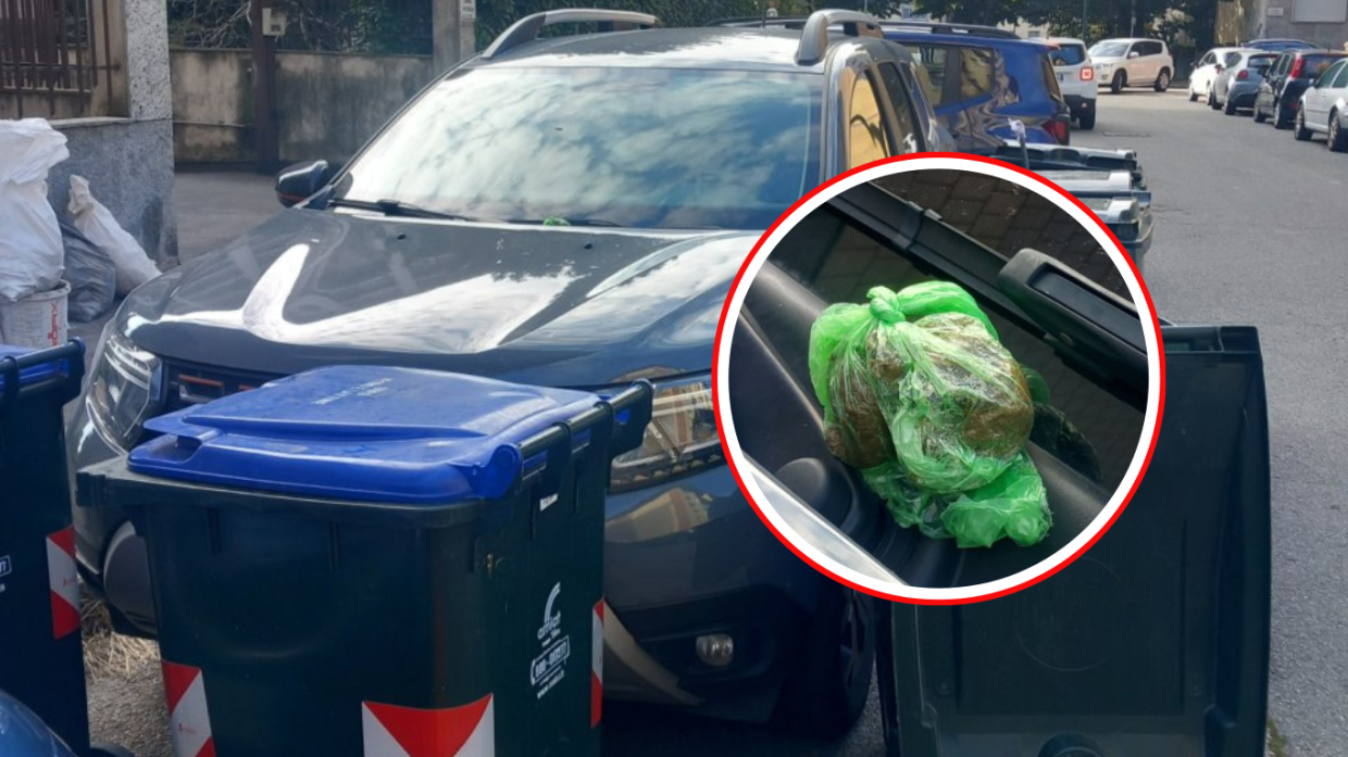 L'auto circondata dai bidoni e con un ricordino.. (Fonte Amico Reporter)