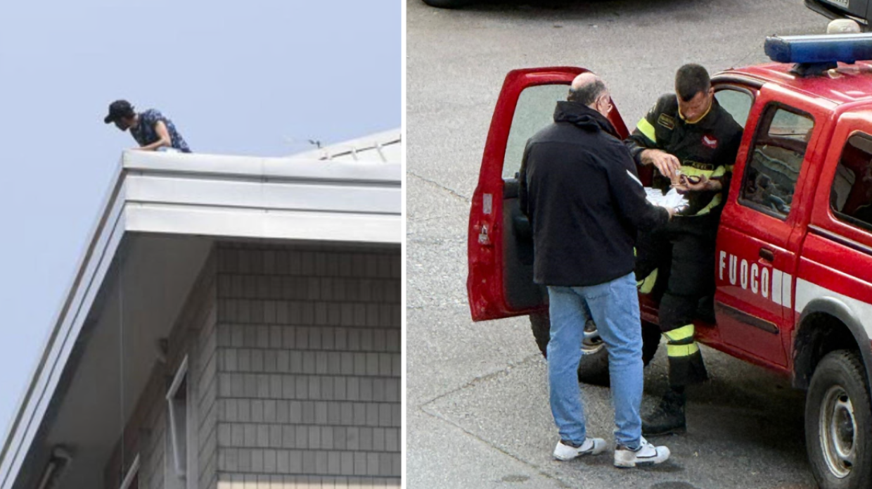 L'uomo (ancora) sul tetto. I residenti portano la colazione ai pompieri